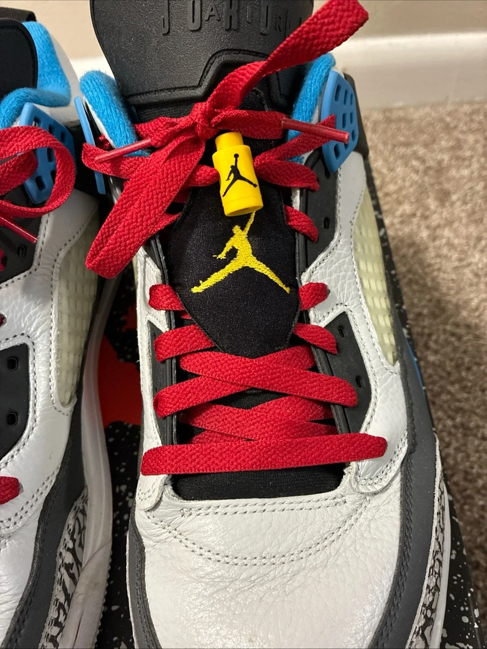 Jordan Men's White Athletic Shoes with Black, Red & Blue Accents